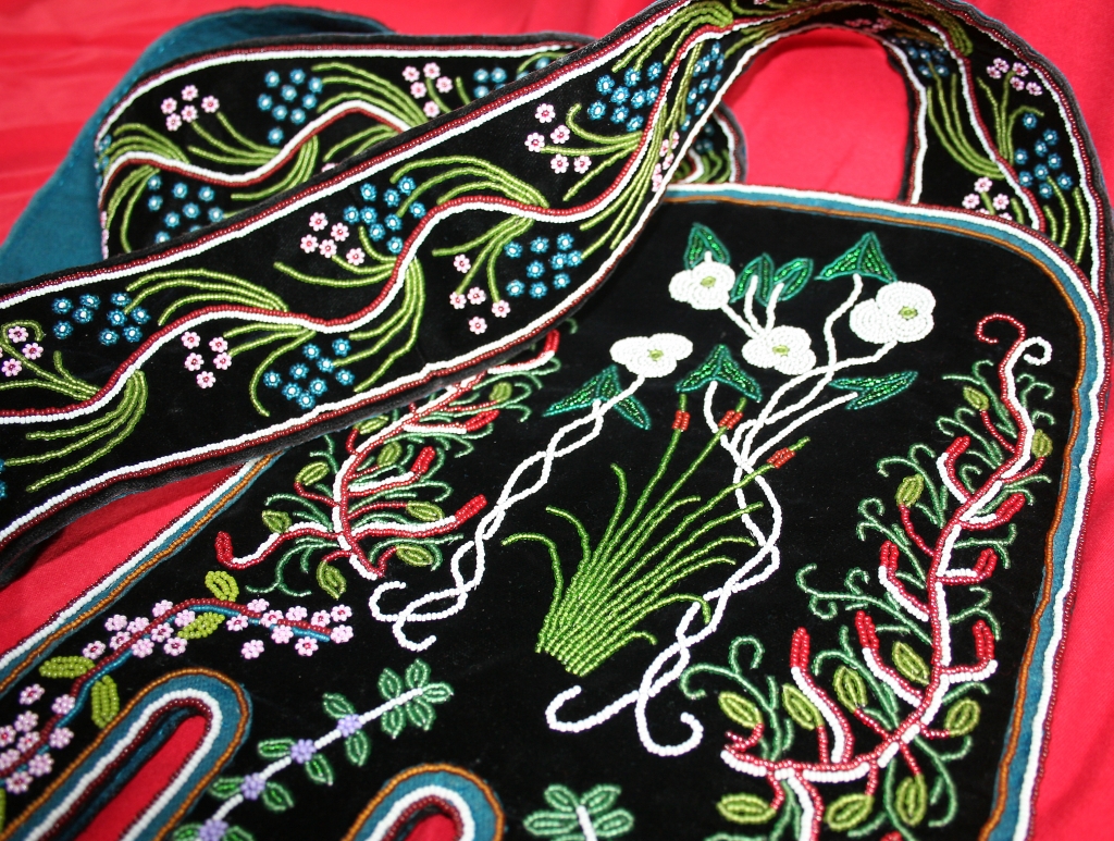 A photo of floral beadwork on black velvet by Ojibway master Marvin Baldeagle Youngman,  St. John, ND.