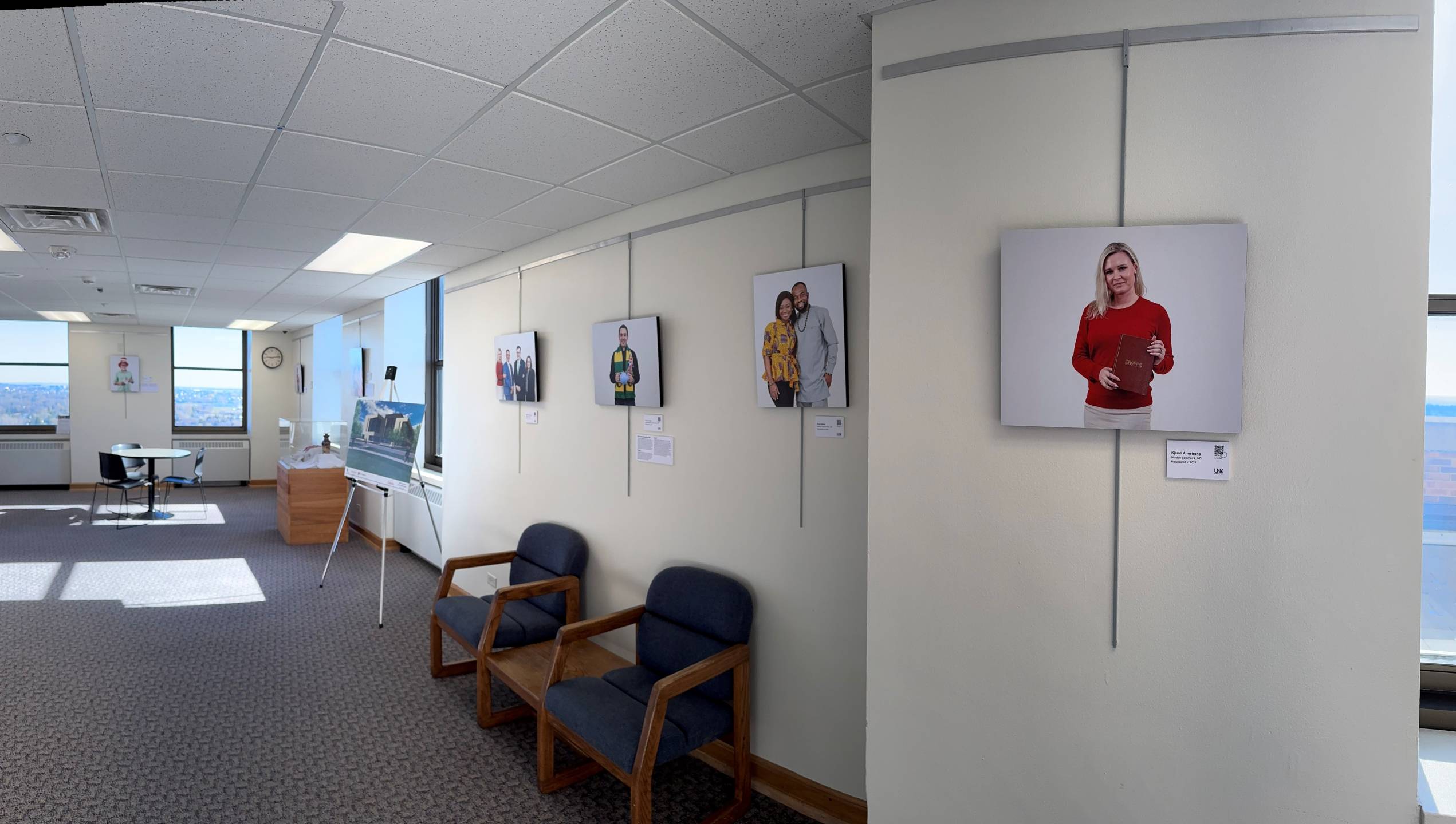 18th floor of the ND Capitol showing a photo exhibit on the hallway walls