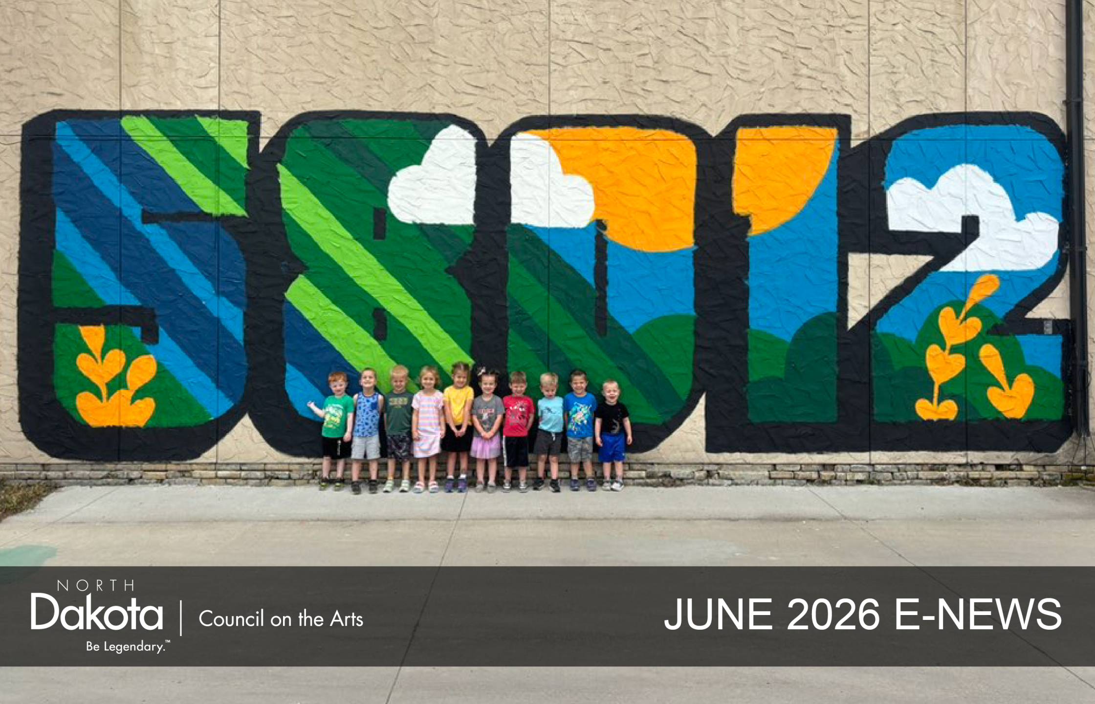 Huge outdoor colorful mural of the Castleton, ND zip code of 58012 with 10 children standing in front of it