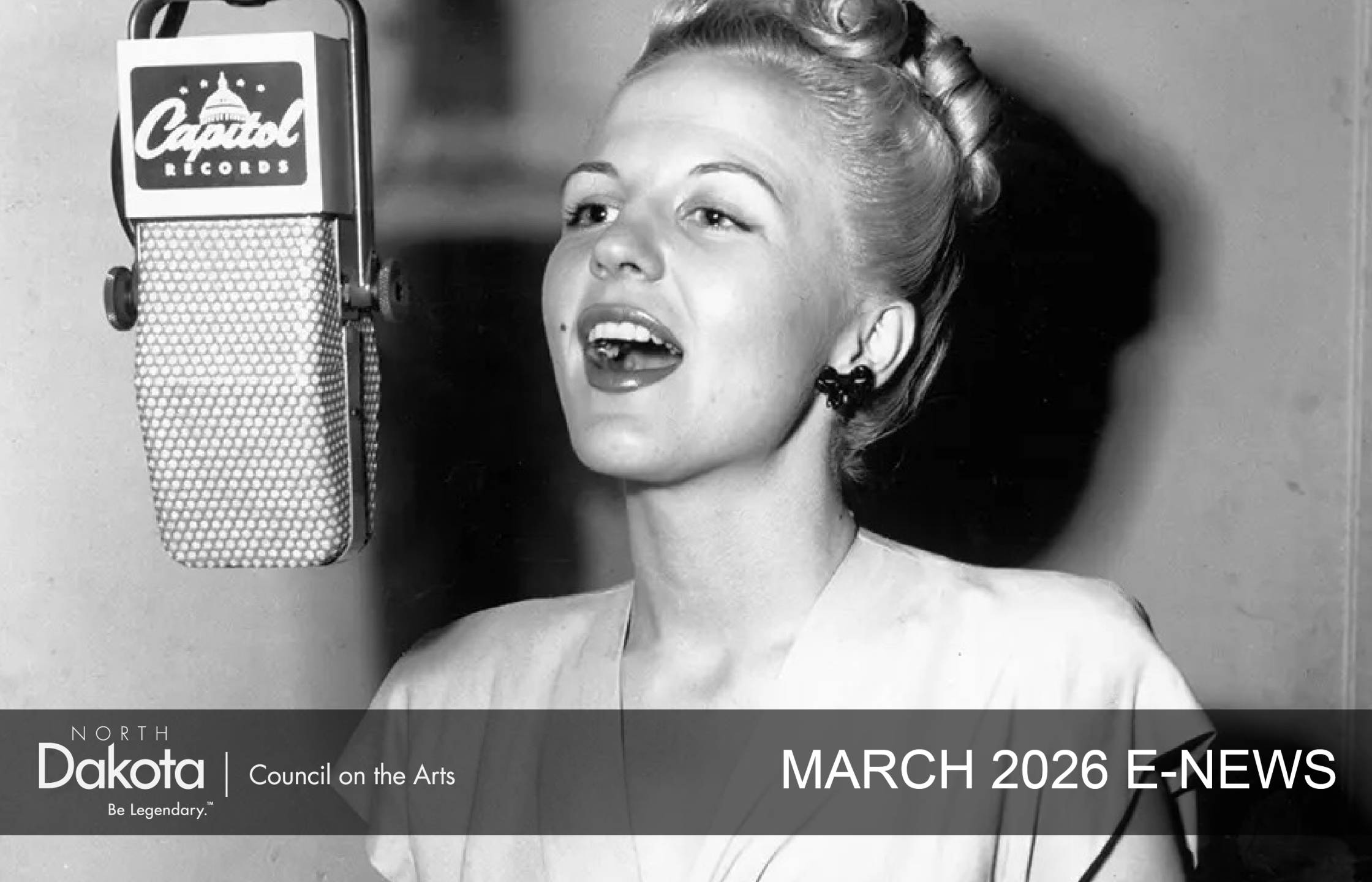 black and white image of Jamestown, ND artist Peggy Lee singing into an old microphone with her hair pulled back