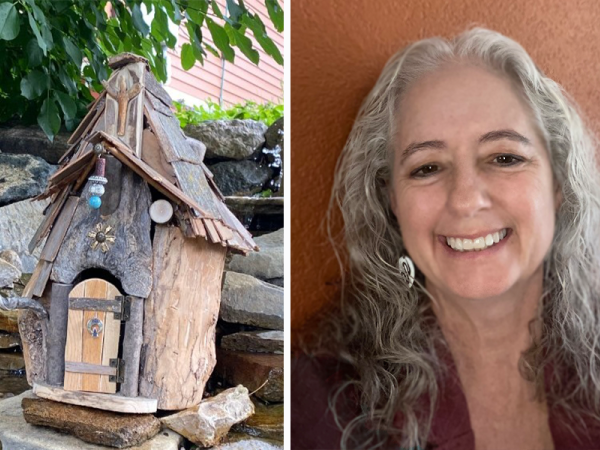 Sculpture of wooden fairy house on the left with head and shoulders image of artist and creator Kimberly Eslinger on the right, with long, curly grey hair and a big toothy smile