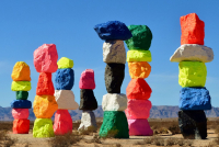 7 columns of colorful stacked rocks create sculpture in rural Nevada called Magic Mountains by Ugo Rondinone
