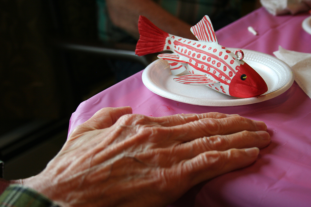 Hand of a woman and fish decoy