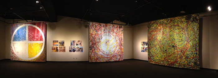 Wheelchair painting as traditional dance creating 12x15 foot pieces