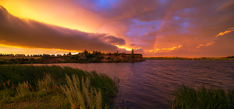 2025 Governor’s Photo Contest Winner of Best in Show: Marshall Lipp for his photo “Storm Passing in a July Morning Sunrise” which captures Sweet Briar Lake in rural Morton County as the sun breaks through the clouds after a summer storm passes.