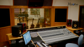 Makoche Recording Studios interior showing sound board, instruments, padded walls