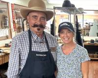 Apprentice Alisha Nord Donnelly standing to the right of master cowboy hat maker Jack Scholl in 2025 