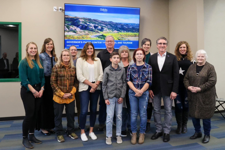 2022 Winners of ND Governor’s Photo Contest standing with Governor Doug Burgum (3rd from right)