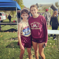 Grey and Scout Ulrickson standing together after running a marathon