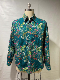 Teal patterned, long sleeve men's collared shirt created by Cynthia McGuire Thiel that won Best in Show in Sewing, Red River Valley Fair 2019