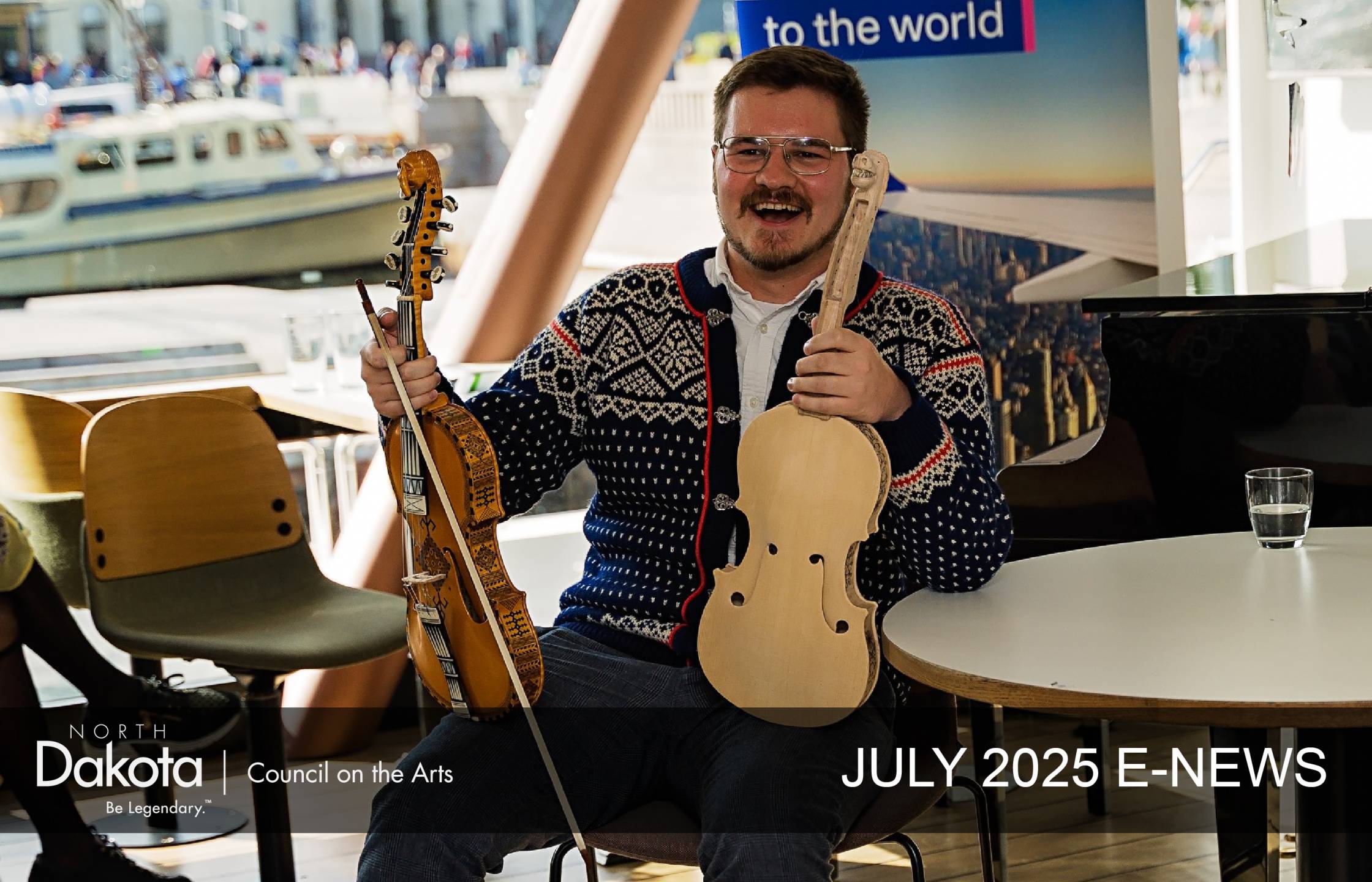 Fargo Spelemannslag member Gus Holley, sitting aboard a ship in Oslo, Norway in July 2025