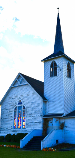 Grue Church steeple with colorful windows