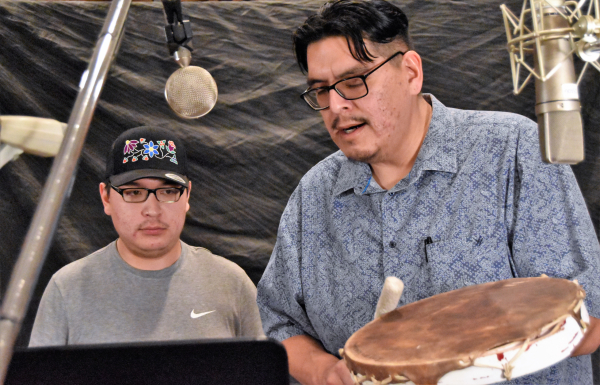 Sound studio in Bismarck, ND, Courtney Yellowfat, with hand drum, and Cody Wasinzi. Photo by Dakota Legacy photo/Dennis J. Neumann