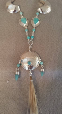 Silver metal necklace with turquoise beads made by ND artist Nelda Schrupp