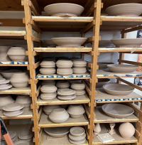 Tama Smith shelf of Prairie Fire Pottery at Studio in Beach