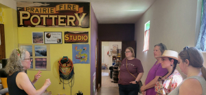 Tama Smith speaking at her Prairie Fire Pottery Studio in Beach