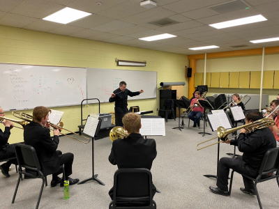 Director Joel Pugh rehearsing with ND Trombone Choir