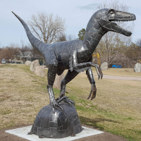 Large Metal Dinosaur sculpture by Ken Nyberg on display at Chahinkapa Park