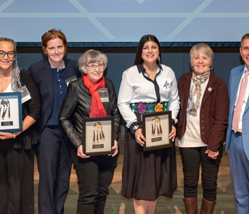 2025 Recipients of the ND Governor's Awards for the Arts standing on a stage with Gov and First Lady Armstrong